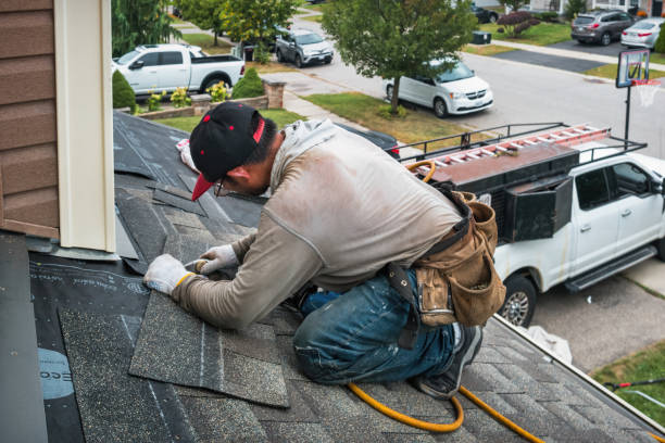 Professional Emergency Roof Repair technician working in Big Sandy, TN